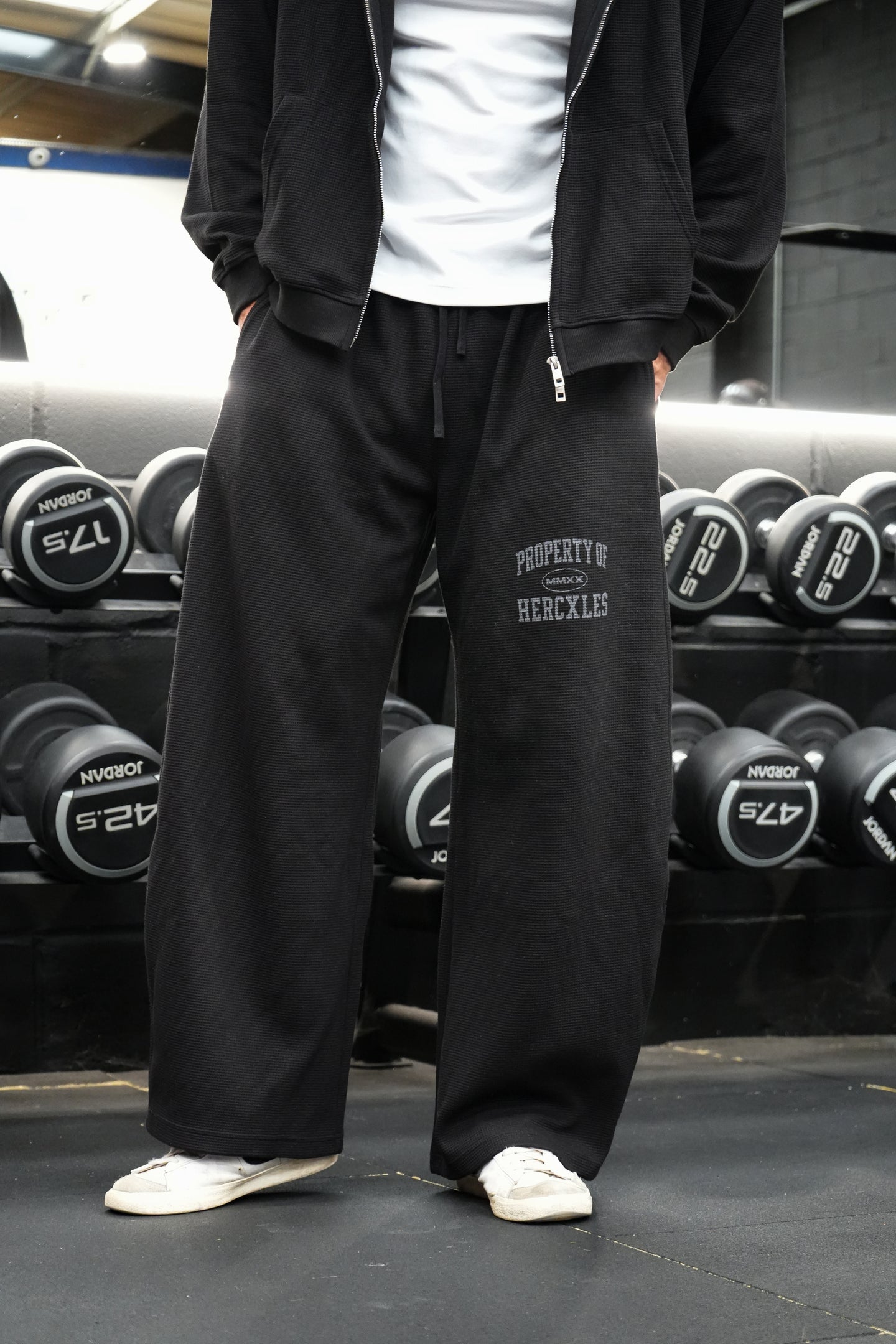 HERCXLES Property Of Waffle Barrel Leg Sweatpants - Black front artwork and fit detail worn by model