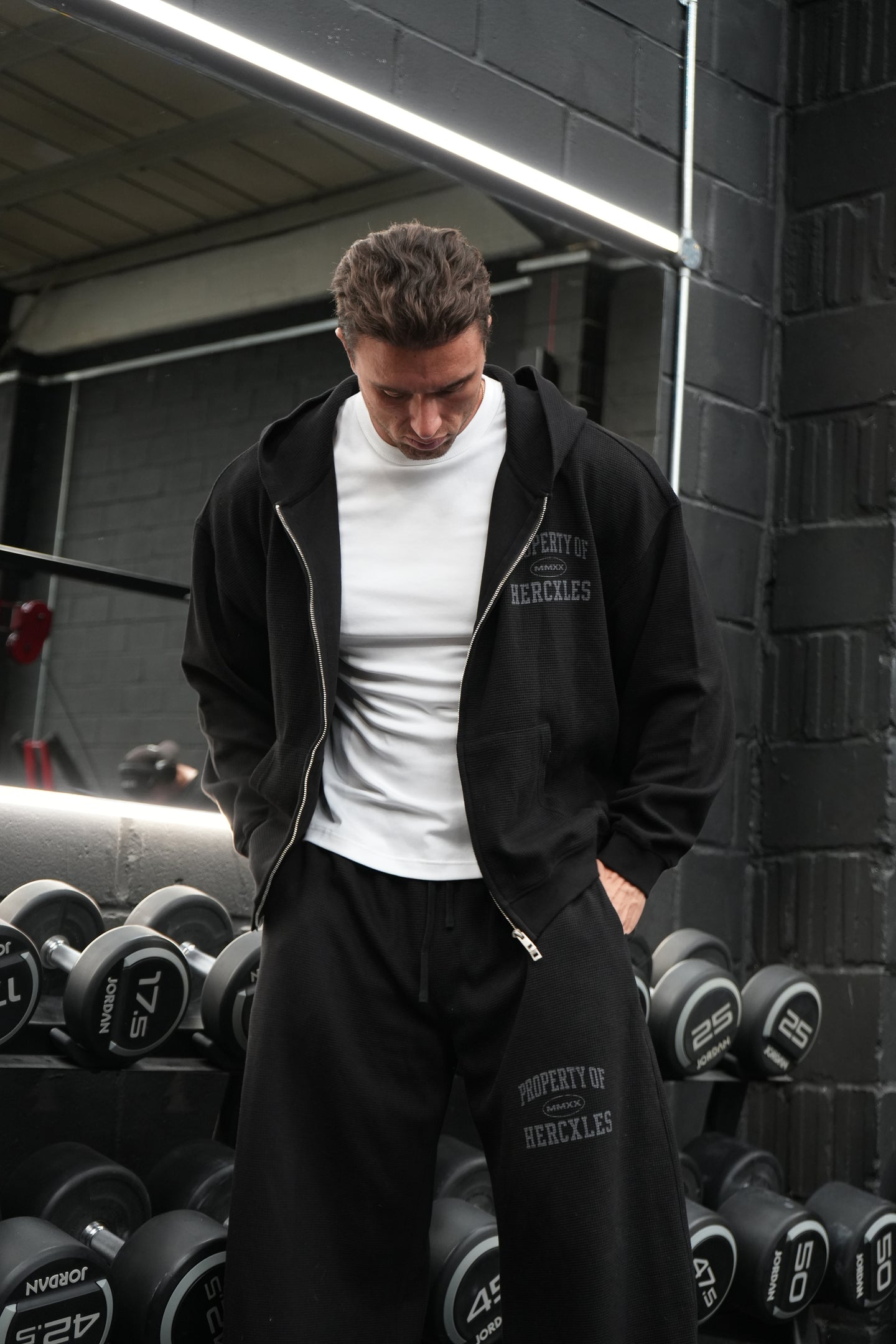 HERCXLES Property Of Waffle Boxy Zip Hoodie - Black standing model relaxed