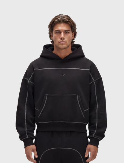 HERCXLES 2026: Contrast-Stitched Boxy Fleece Hoodie - Black model front