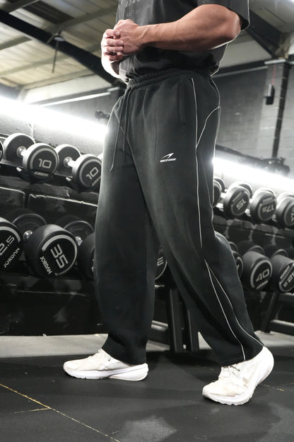HERCSTUDIOS Reflective Sweatpants - Black three-quarter model photo