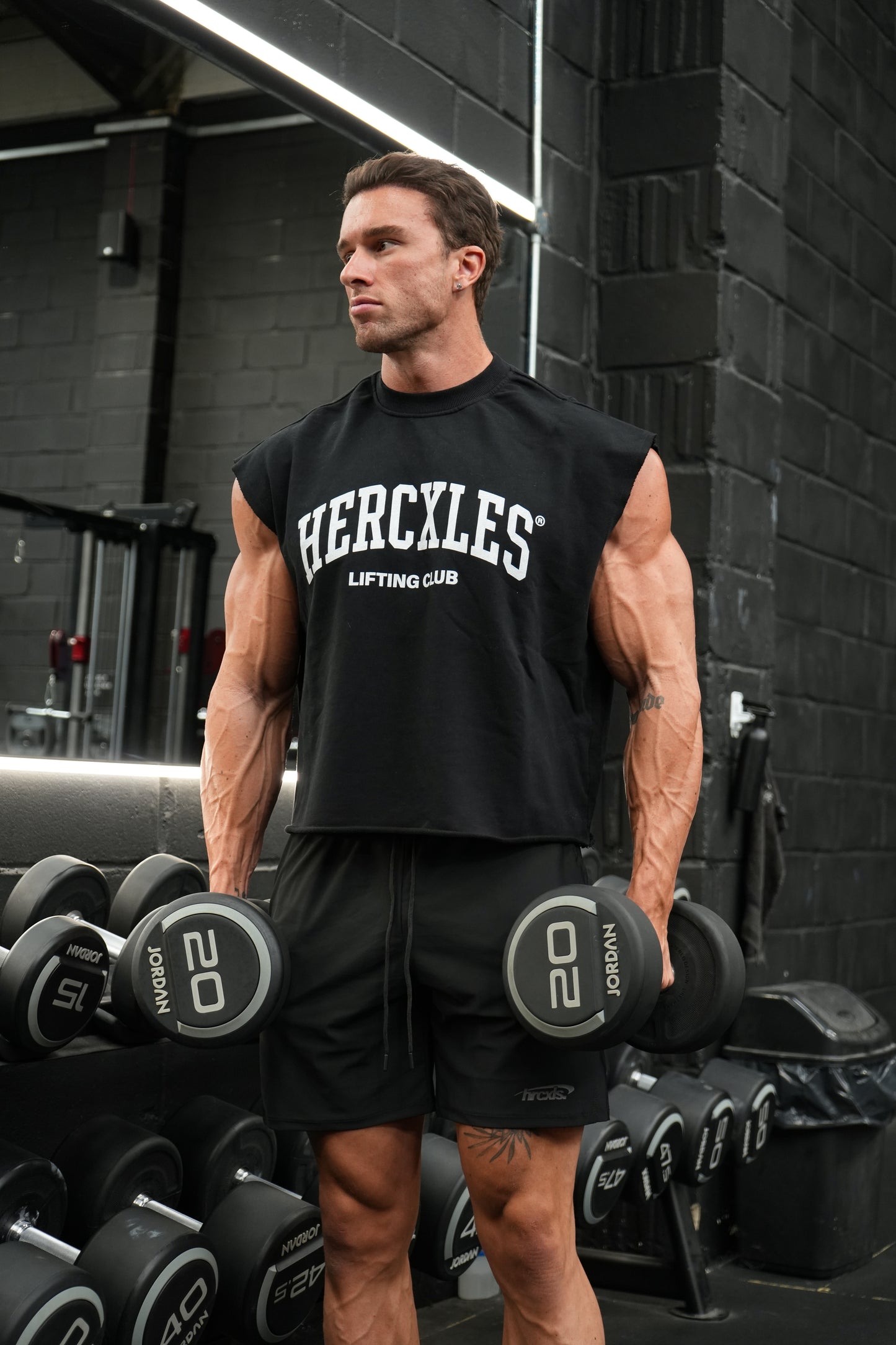 HERCXLES Lifting Club Boxy Cut Off - Black model holding dumbbells