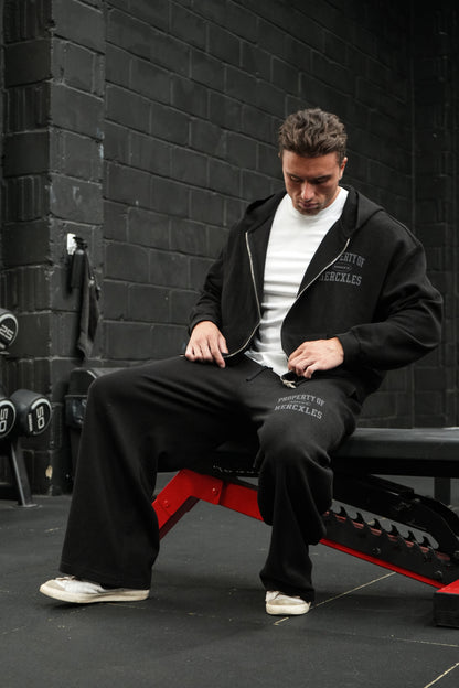 HERCXLES Property Of Waffle Barrel Leg Sweatpants - Black seated model detail