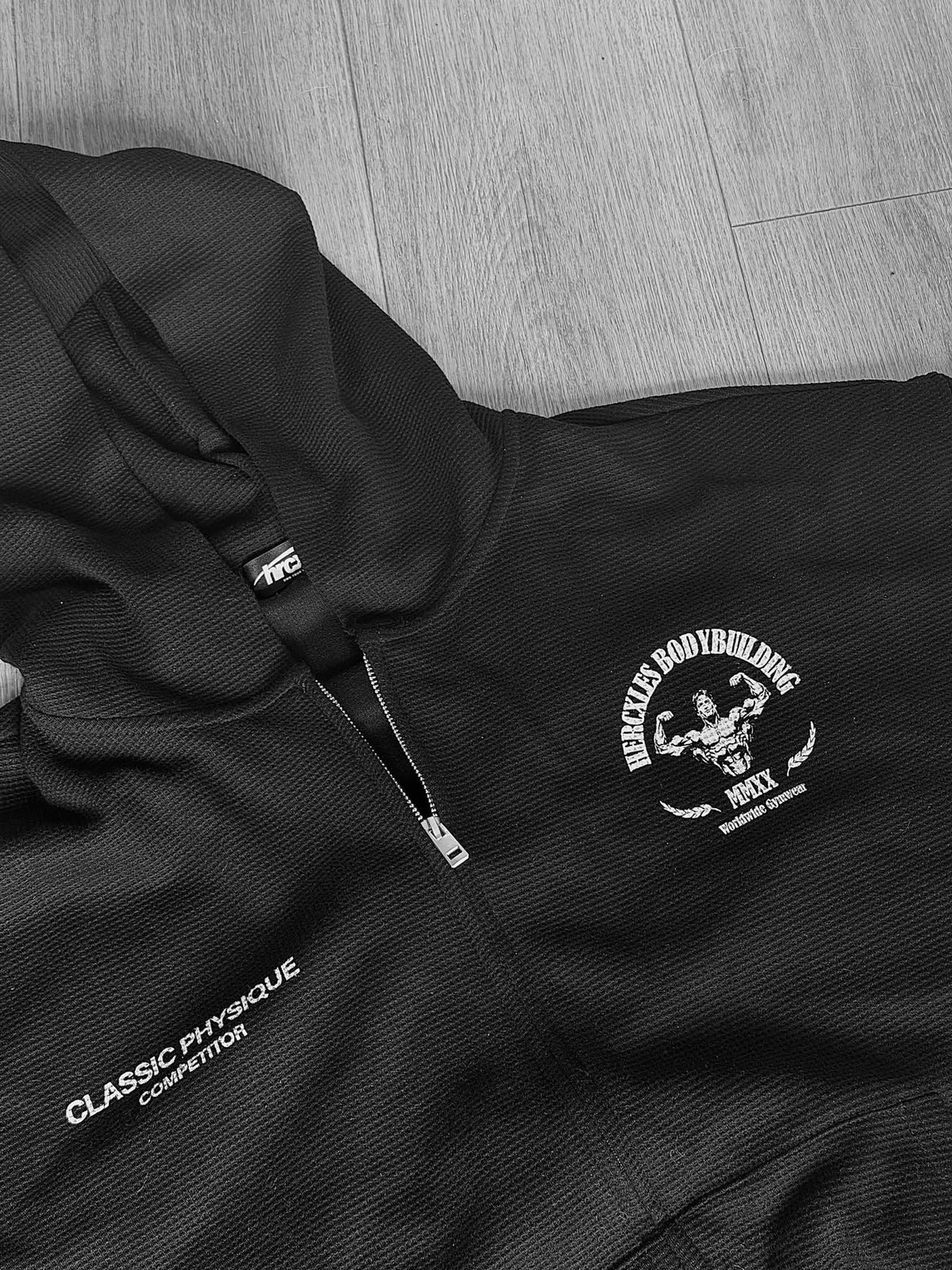 Worldwide Competitor Zip Hoodie - Black / White model close-up of zip hoodie and matching joggers (p1)