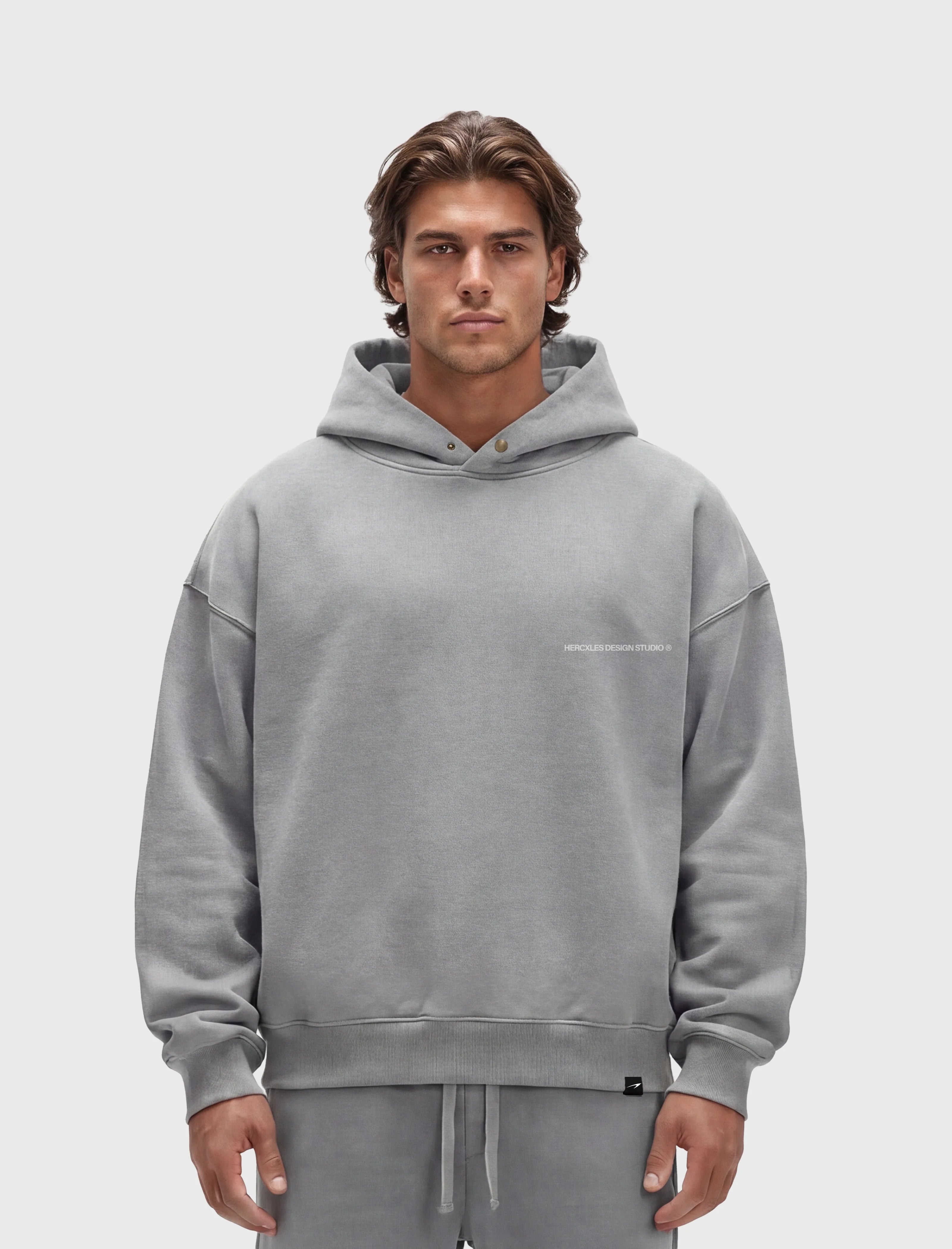 HERCXLES 2026: Studios Distressed Hoodie - Light Grey model front